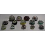 Fourteen Scottish millefiori glass paperweights including Strathearn and Perthshire, some star