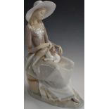 Lladro figurine of a lady with lap dog, H33cm