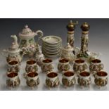 Capodimonte twelve place setting tea set with relief moulded figural decoration and two salt and