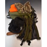 A collection of sporting or shooting equipment including game or fishing bag, gaiters, camouflage