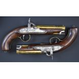 A pair of Bond of London percussion converted from flintlock hammer action pistols with engraved