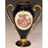 Limoges pedestal twin handled vase with Watteau scene and script 'Fragonard', H25cm