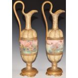 A pair of c1900 Royal Doulton pedestal ewers hand decorated with flowers, H 35cm