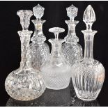 Five cut glass decanters including a pair of Georgian examples, largest 32cm tall.