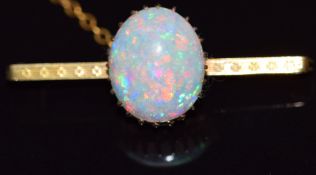 A 9ct gold brooch set with an opal cabochon, 3g