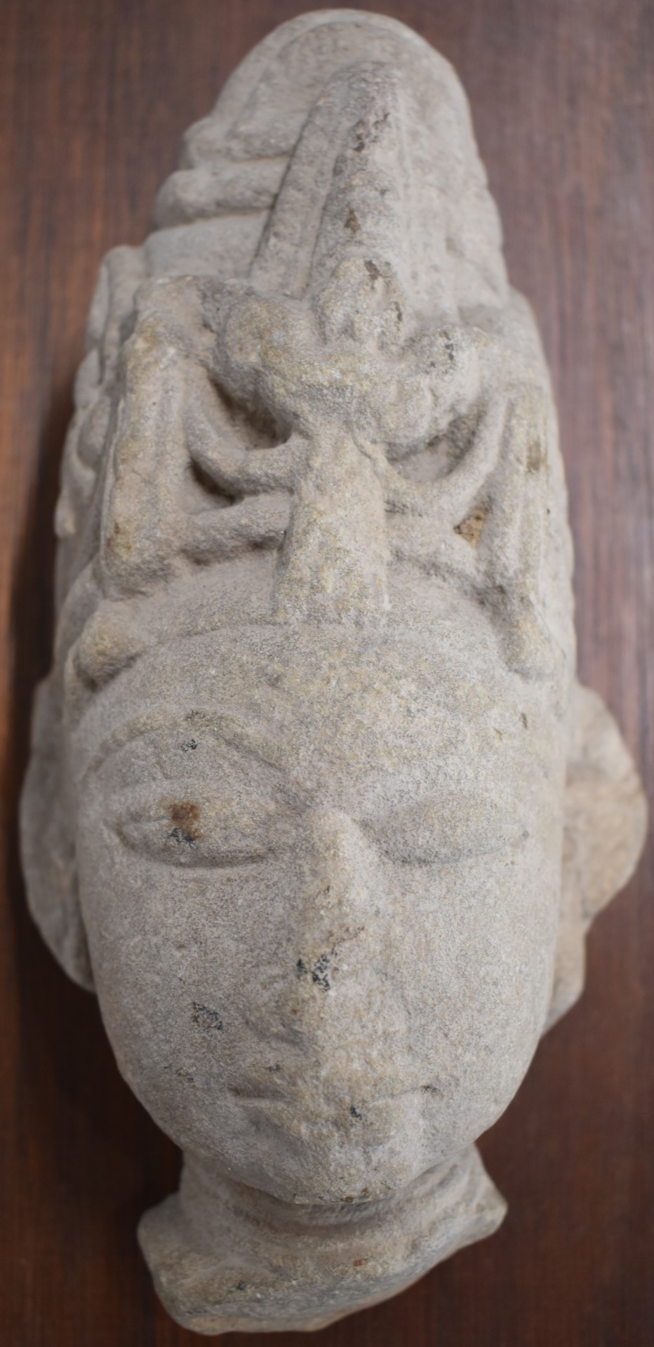 Carved stone Buddha mounted on a hardwood plaque, H23cm, the plaque 43 x 28.5cm