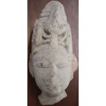 Carved stone Buddha mounted on a hardwood plaque, H23cm, the plaque 43 x 28.5cm