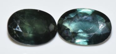 Two loose natural green sapphires measuring approximately 0.86ct & 0.9ct