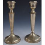 Elizabeth II pair of hallmarked silver candlesticks, Birmingham 1967, maker Charles S Green & Co
