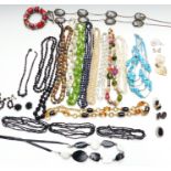Collection of costume jewellery including Sphinx earrings, French jet beaded necklaces, silver