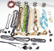 Collection of costume jewellery including Sphinx earrings, French jet beaded necklaces, silver