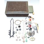 A collection of jewellery including silver pendants, agate plaques, etc in a carved wooden box