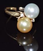 A 9k gold ring set with two pearls