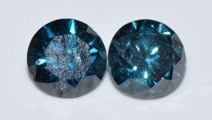 Two loose round cut blue diamonds, 0.14g