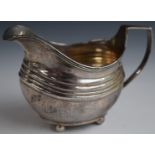 Georgian hallmarked silver milk jug raised on four ball feet, London 1815, maker Thomas Richards,