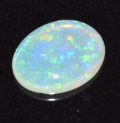 A loose oval opal cabochon measuring approximately 0.93cts