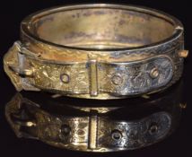 Victorian silver bangle in the form of a buckle with engraved foliate decoration, Birmingham 1884