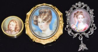 Victorian yellow metal buckle set with a portrait miniature of a young woman, a silver brooch set