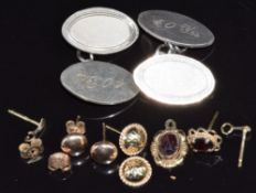 A pair of silver cufflinks and two pairs of 9ct gold earrings, 1.5g