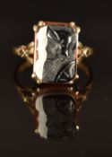 A 9ct gold ring set with an agate cameo, size O, 4.1g