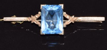 A 9ct gold brooch set with a blue topaz, 7.3g