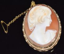 A 9ct gold brooch set with a cameo of a young woman, 3.3 x 4.2cm