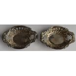 Victorian pair of hallmarked silver bon bon dishes with pierced and embossed decoration, Chester