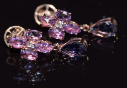 A pair of 9ct gold earrings set with purple sapphires and iolite, 3.9g