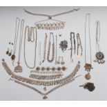 A collection of white metal/ silver jewellery including bracelets, necklaces, brooch, watch chain,