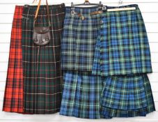 Seven kilts and kilted skirts in various tartans and a leather sporran