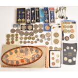 A collection of UK and Canadian coins to include a Millennium set, Coronation sets, modern crowns,