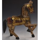 Indian carved wooden horse with gilt and painted decoration