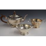 George V hallmarked silver three piece tea set with beaded decoration, Birmingham 1930, maker