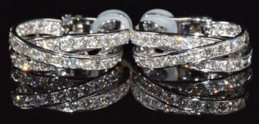 A pair of 18ct white gold earrings set with diamonds, total diamond weight approximately 5cts, 18.