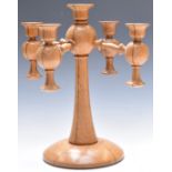 Arts and Crafts turned oak pedestal candelabra, diameter 32cm, H34cm
