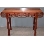 Carved oriental hardwood altar table with carved decoration, W127 x D43 x H83cm