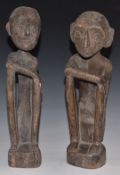 A pair of carved African tribal figures, H35cm