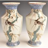 A pair of Japanese porcelain pedestal vases with enamelled decoration of swifts/swallows in