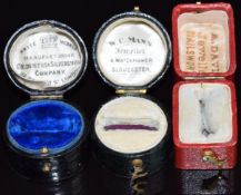 Three ring boxes comprising Goldsmiths & Silversmiths Company, W.C.Mann, Gloucester and A.Davis,
