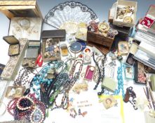 A collection of costume jewellery including vintage beaded necklaces, filigree brooch, silver chain,