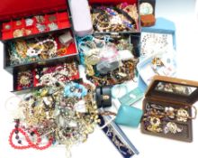 A collection of costume jewellery including brooches, necklaces, etc