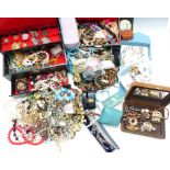 A collection of costume jewellery including brooches, necklaces, etc