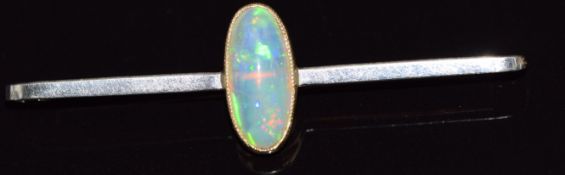A 9ct gold brooch set with an opal cabochon, 2.6g