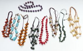 A collection of agate beaded necklaces including amethyst