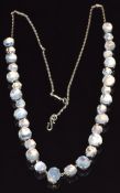 A c1920 silver necklace set with moonstone cabochons, 30.7g