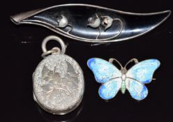 Victorian silver locket, an enamel set silver butterfly and a Norwegian silver brooch set with