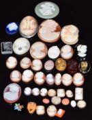 A collection of loose cameos including small agate example, miniature examples, onyx, etc
