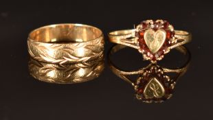 A 9ct gold ring set with garnets in a heart shape (size P, 1.7g) and a 9ct gold ring, size L, 1.8g