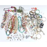 A collection of jewellery including beaded necklaces, 9ct gold cameo ring, silver charms, silver