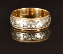 A 9ct gold bi-coloured wedding band/ ring, size N, 4.4g